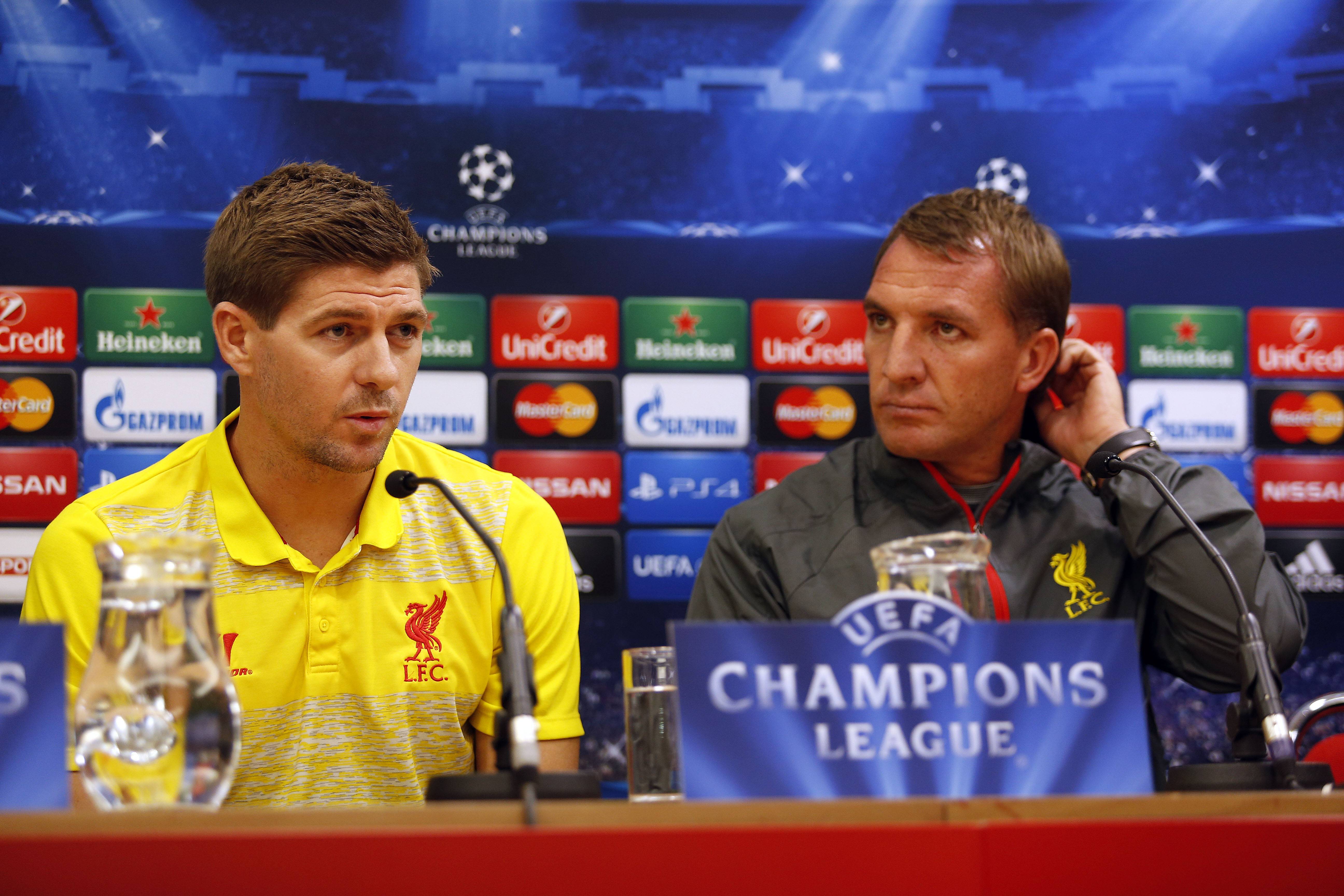 Brendan Rodgers the manager of Liverpool and Steven Gerrard face the media