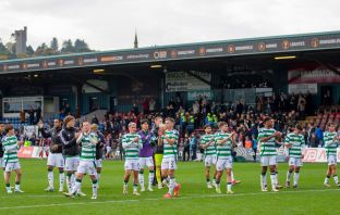 Celtic players acknowledge the away support