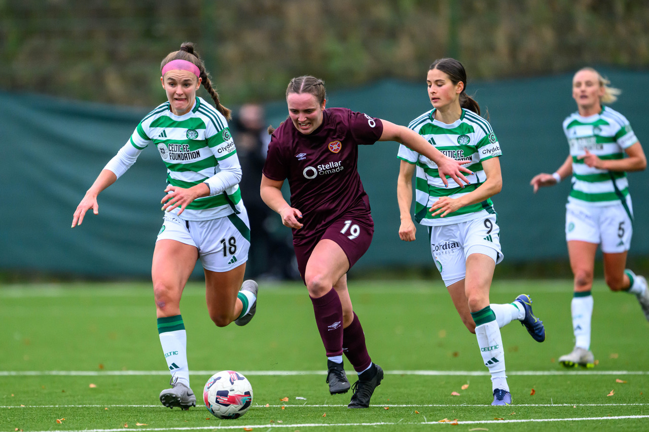 Bayley Hutchison runs past Caitlin Hayes