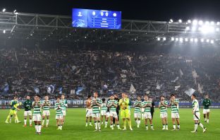 Celtic FC players applaud the fans