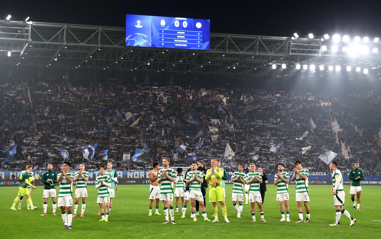 Celtic FC players applaud the fans