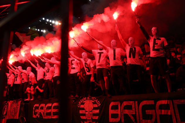 Celtic fans in Dortmund holding flares