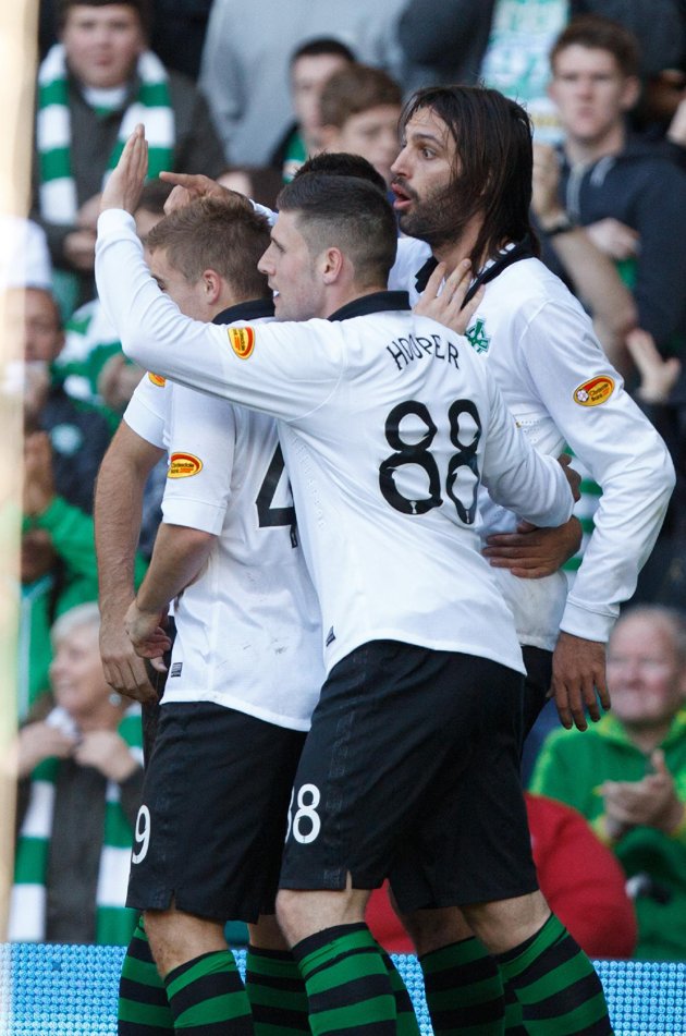 Samaras celebrates with his Celtic teammates after scoring against Hearts