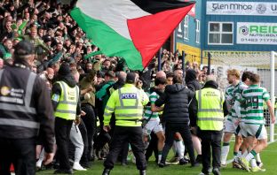 Nicolas Kuhn, already on a yellow, celebrates with the Celtic supporters after scoring the winner