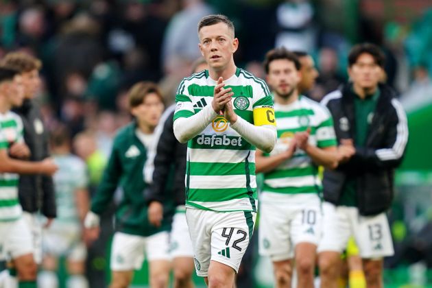 Callum McGregor applauds the fans