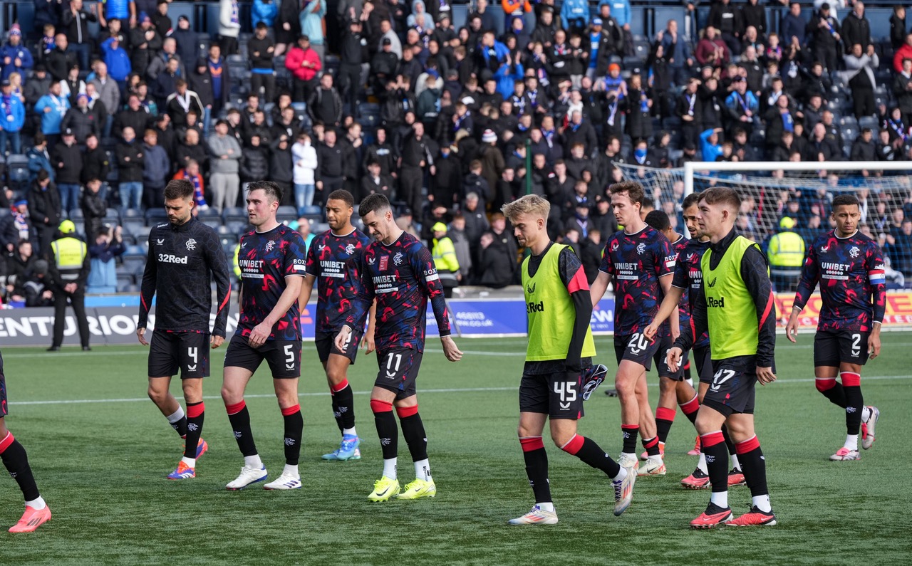 Dejected theRangers players walk off