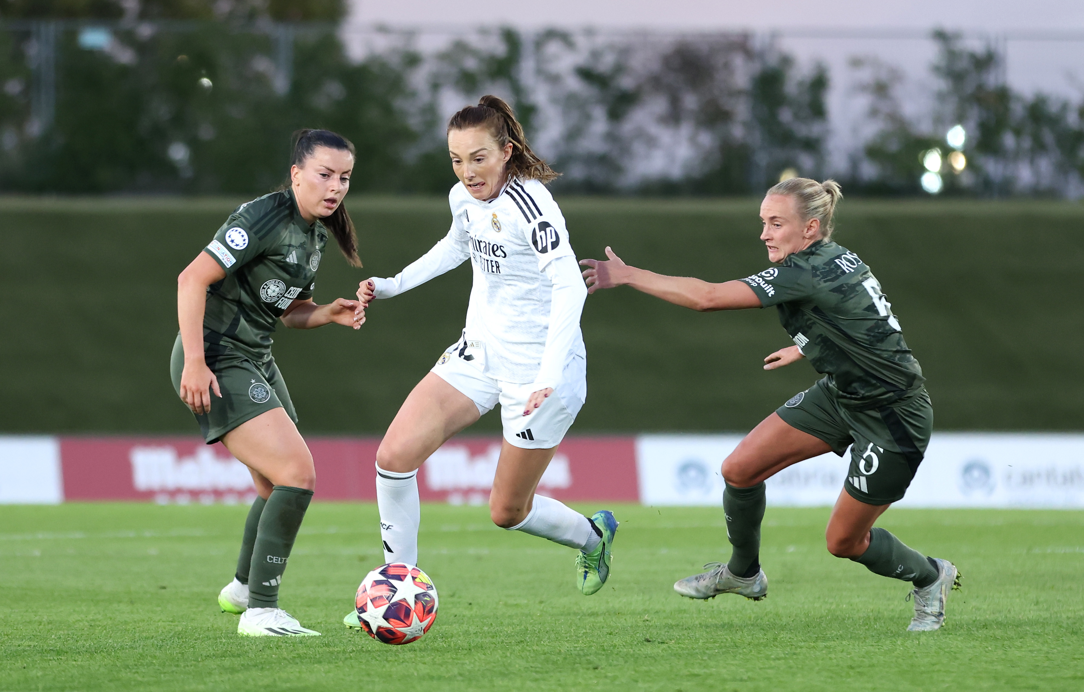 Caroline Weir of Real Madrid is challenged by Amy Gallacher and Natalie Ross 