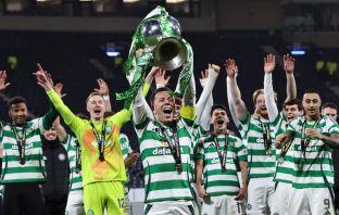 Callum McGregor lifts the cup