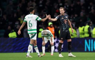 Harry Kane shakes hands with Auston Trusty