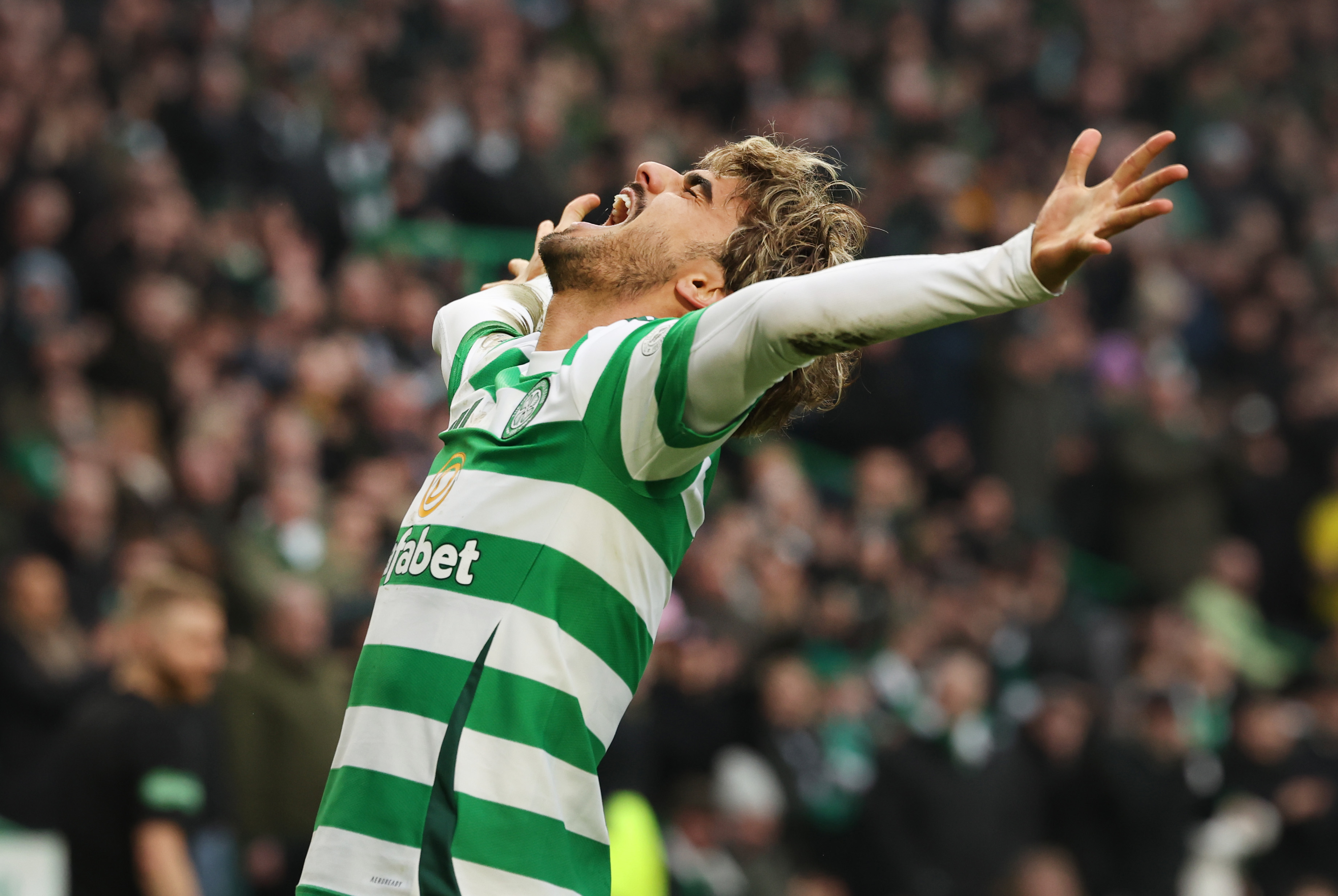 Jota of Celtic celebrates