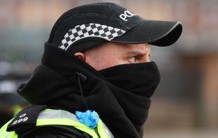 Police officer wearing a face covering
