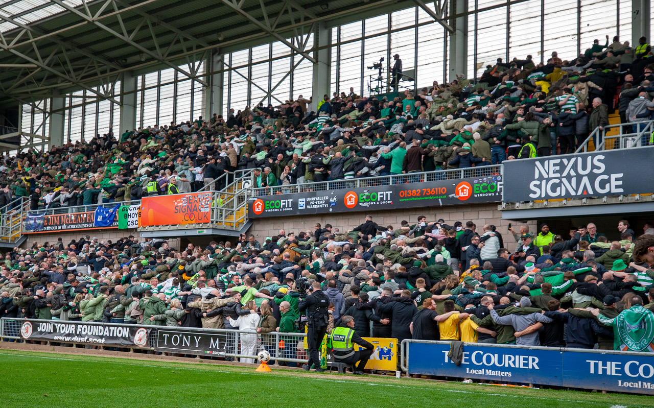 Celtic supporters doing the Huddle