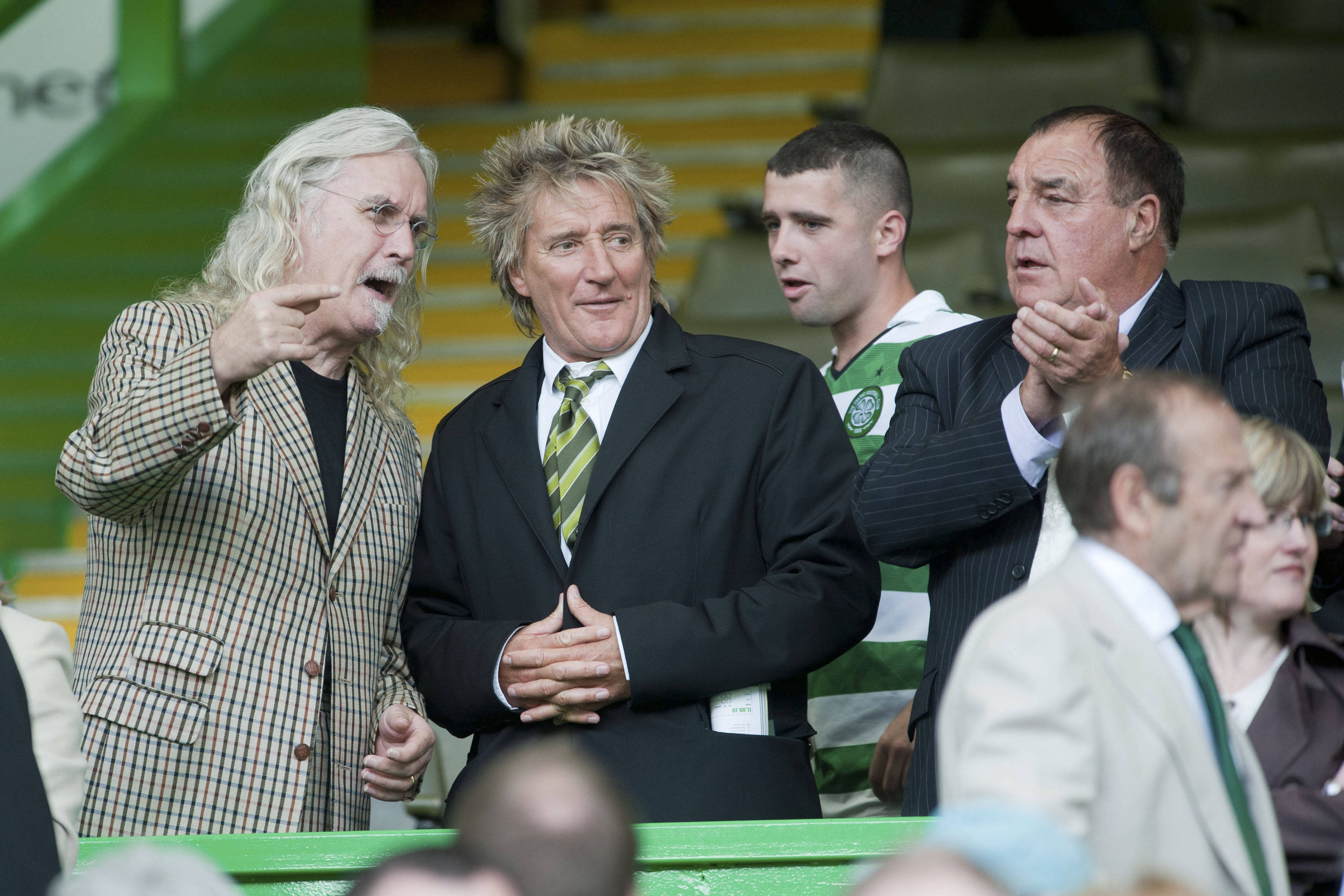 Billy Connolly and Rod Stewart share a joke back in 2010.