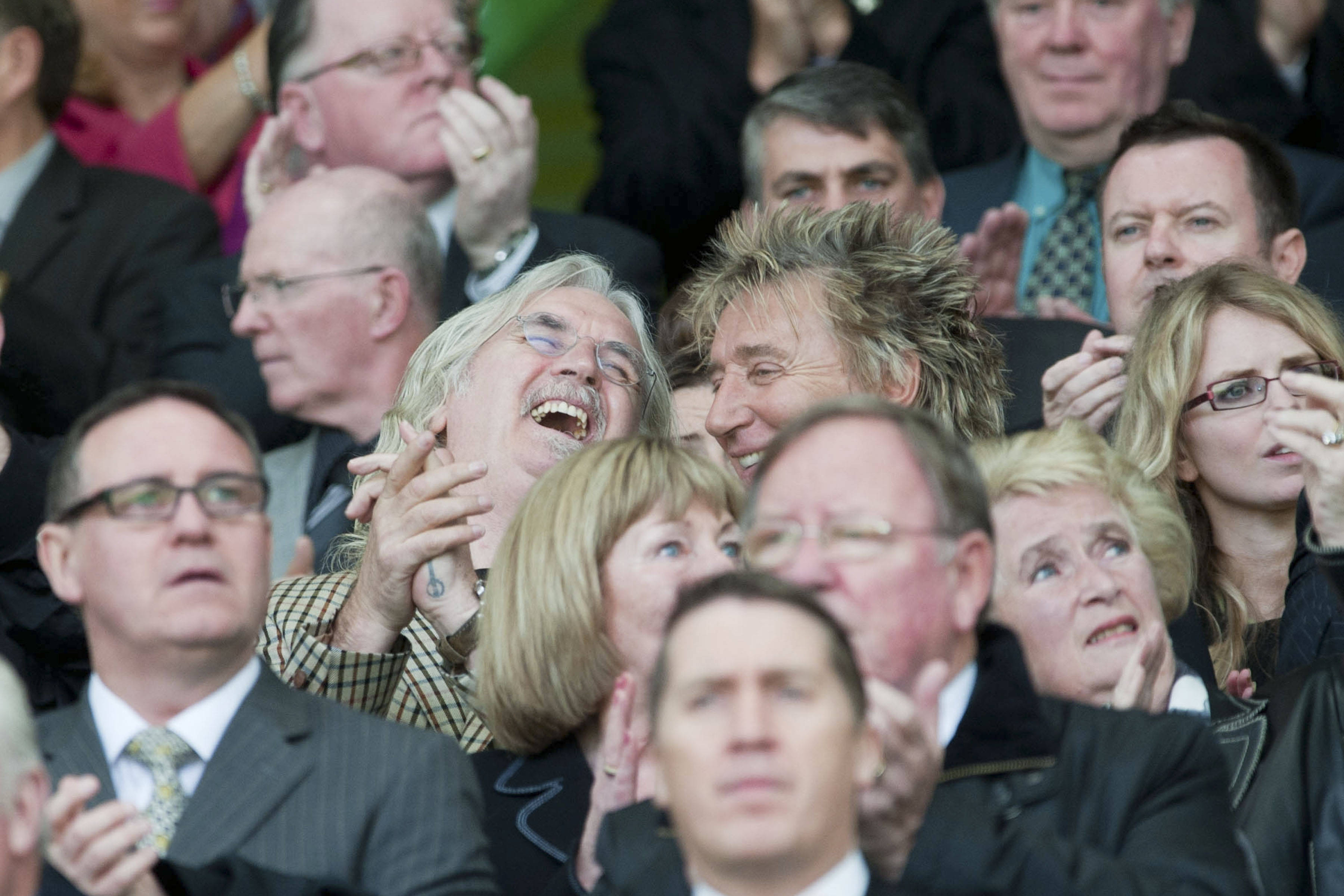 Billy Connolly and Rod Stewart share a joke back in 2010.