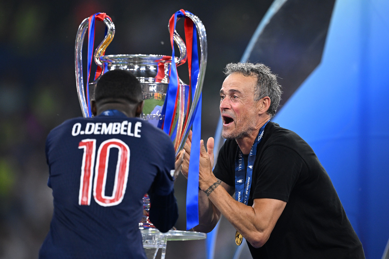Luis Enrique, Head Coach of Paris Saint-Germain, reacts with Ousmane Dembele