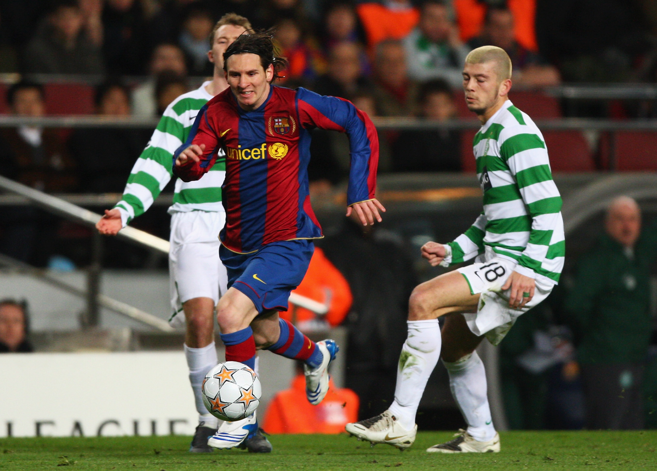 Lionel Messi of Barcelona breaks through the Celtic defence