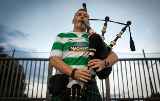 A piper performs ahead of Ajax v Celtic