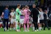 James Forrest of Celtic and Scott Bain of Falkirk embrace