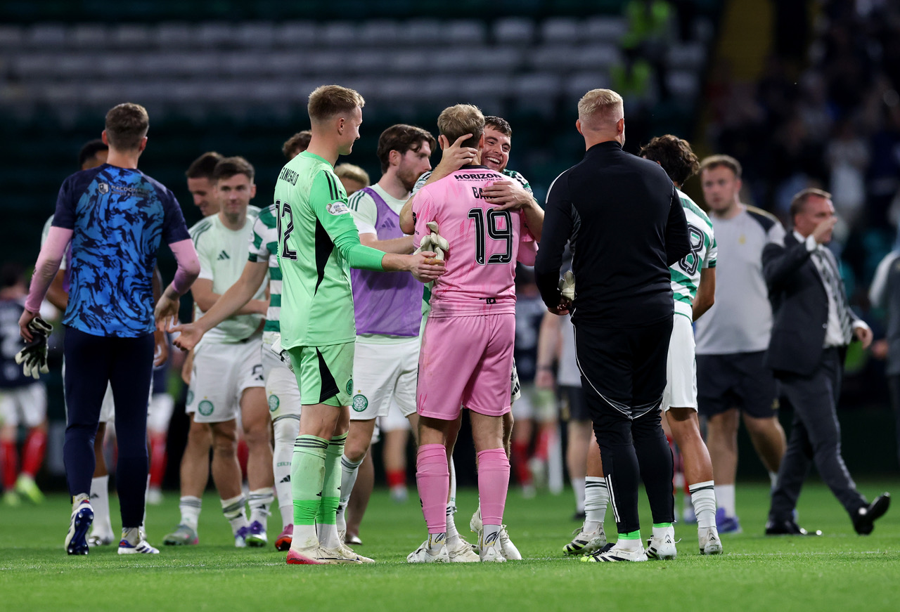James Forrest of Celtic and Scott Bain of Falkirk embrace
