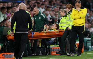 Alistair Johnston of Celtic is stretchered off