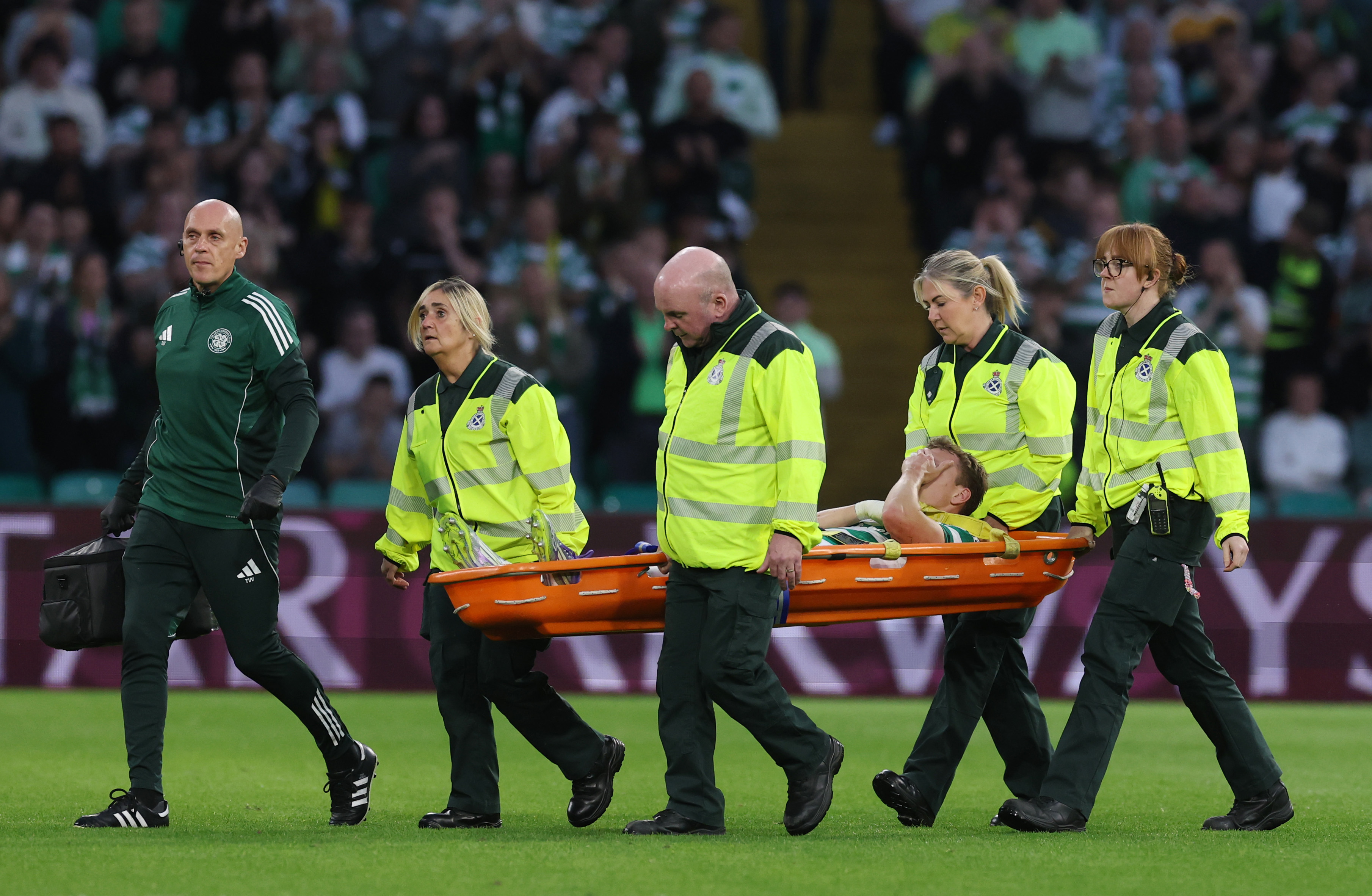 Alistair Johnston of Celtic is stretchered off