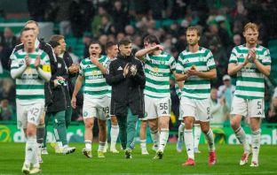Celtic players applaud the support