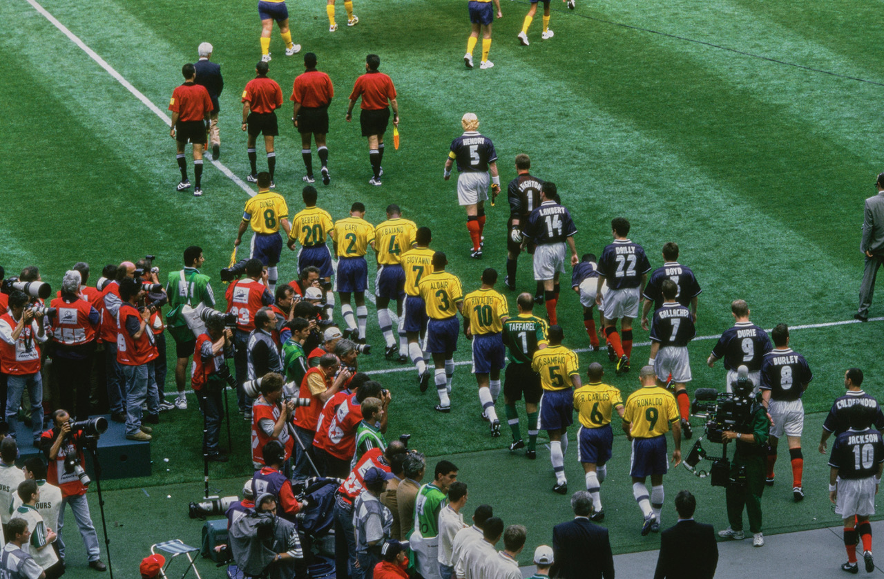Brazil and Scotland teams come out for 1998 World Cup opener.