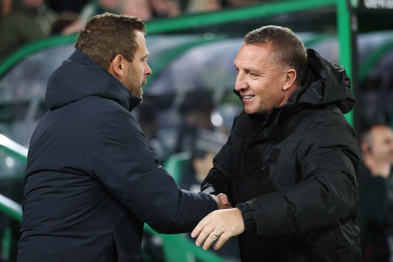 Brendan Rodgers, Manager of Celtic, greets Jurgen Saumel, Head Coach of Sturm Graz