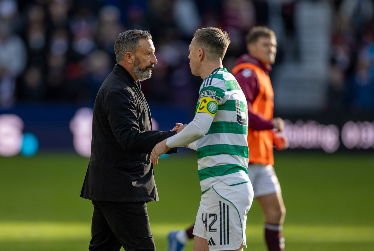 Callum McGregor shakes hands with Derek McInnes after the match.