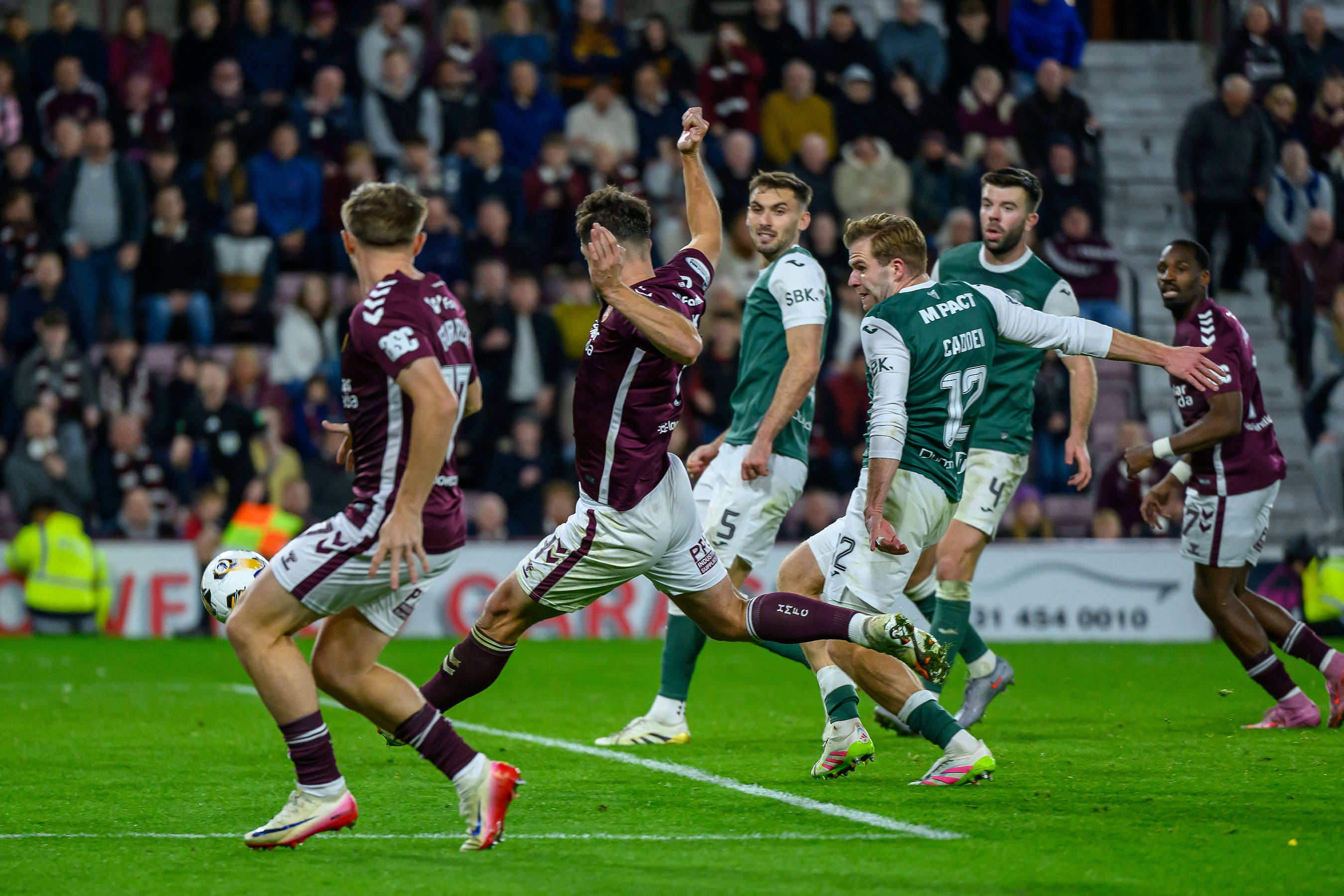 Craig Halkett of Hearts scores