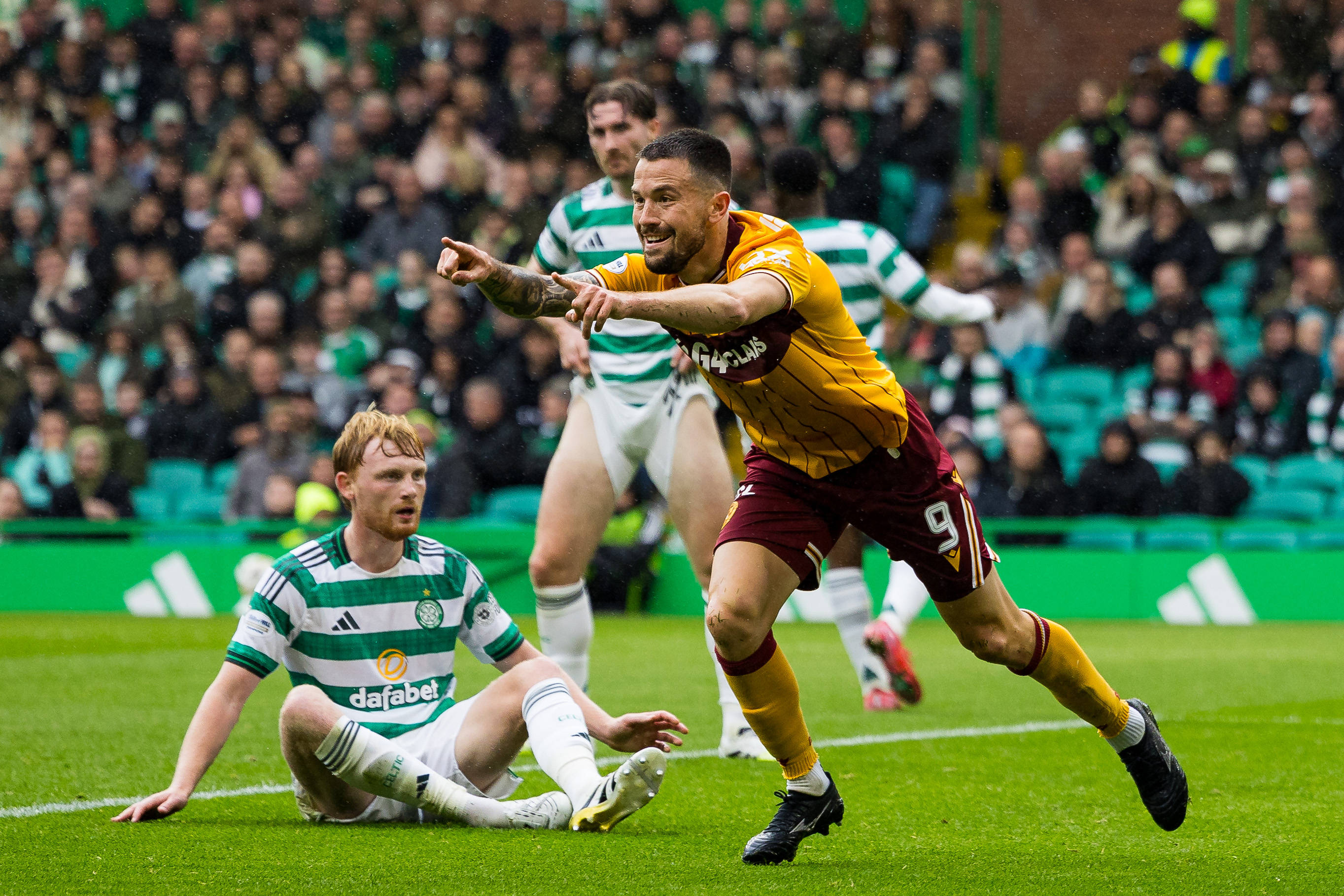 Liam Scales looks on as Motherwell celebrate
