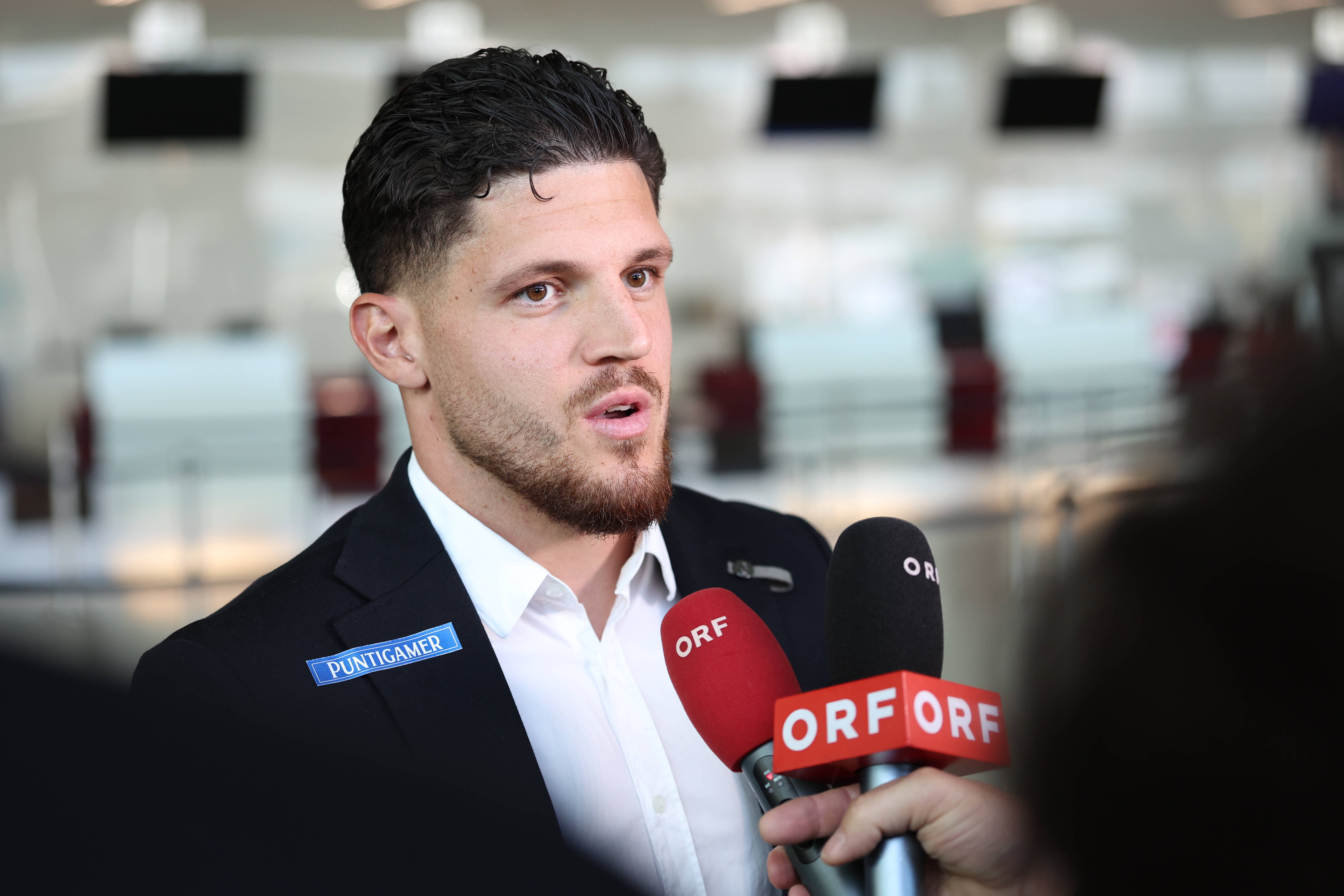 Emir Karic of SK Sturm Graz at airport heading to Glasgow.