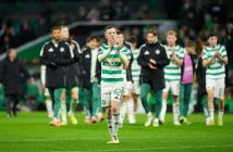 Callum McGregor applauds the fans