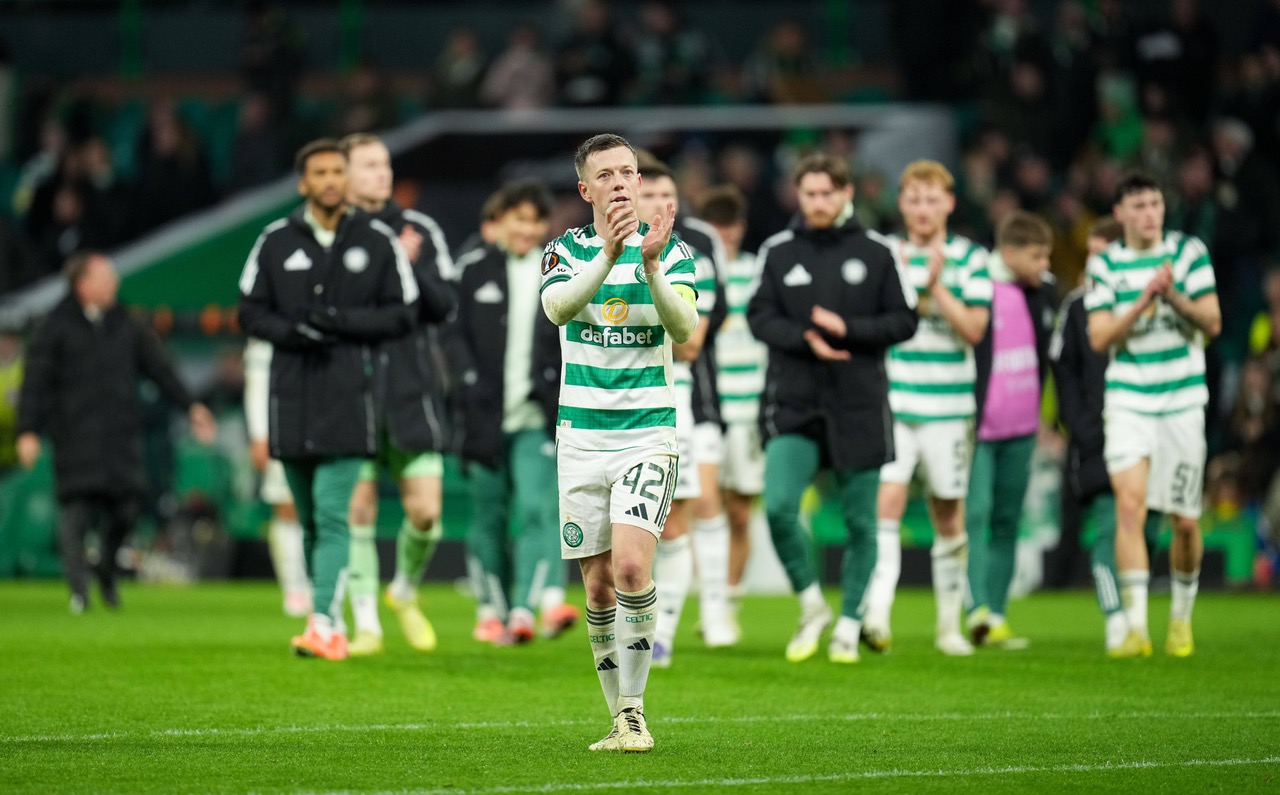 Callum McGregor applauds the fans