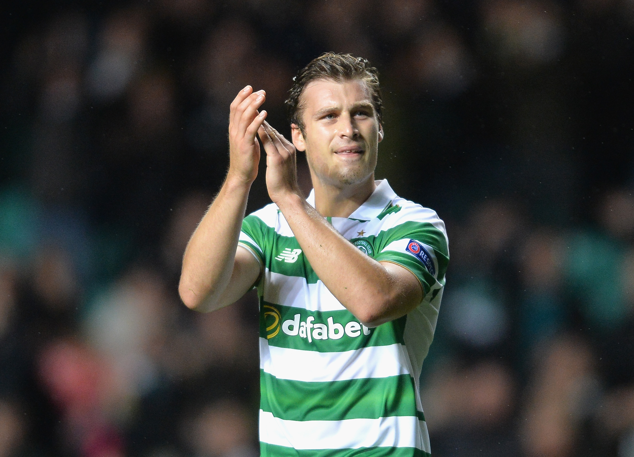 Erik Sviatchenko of Celtic applauds the fans