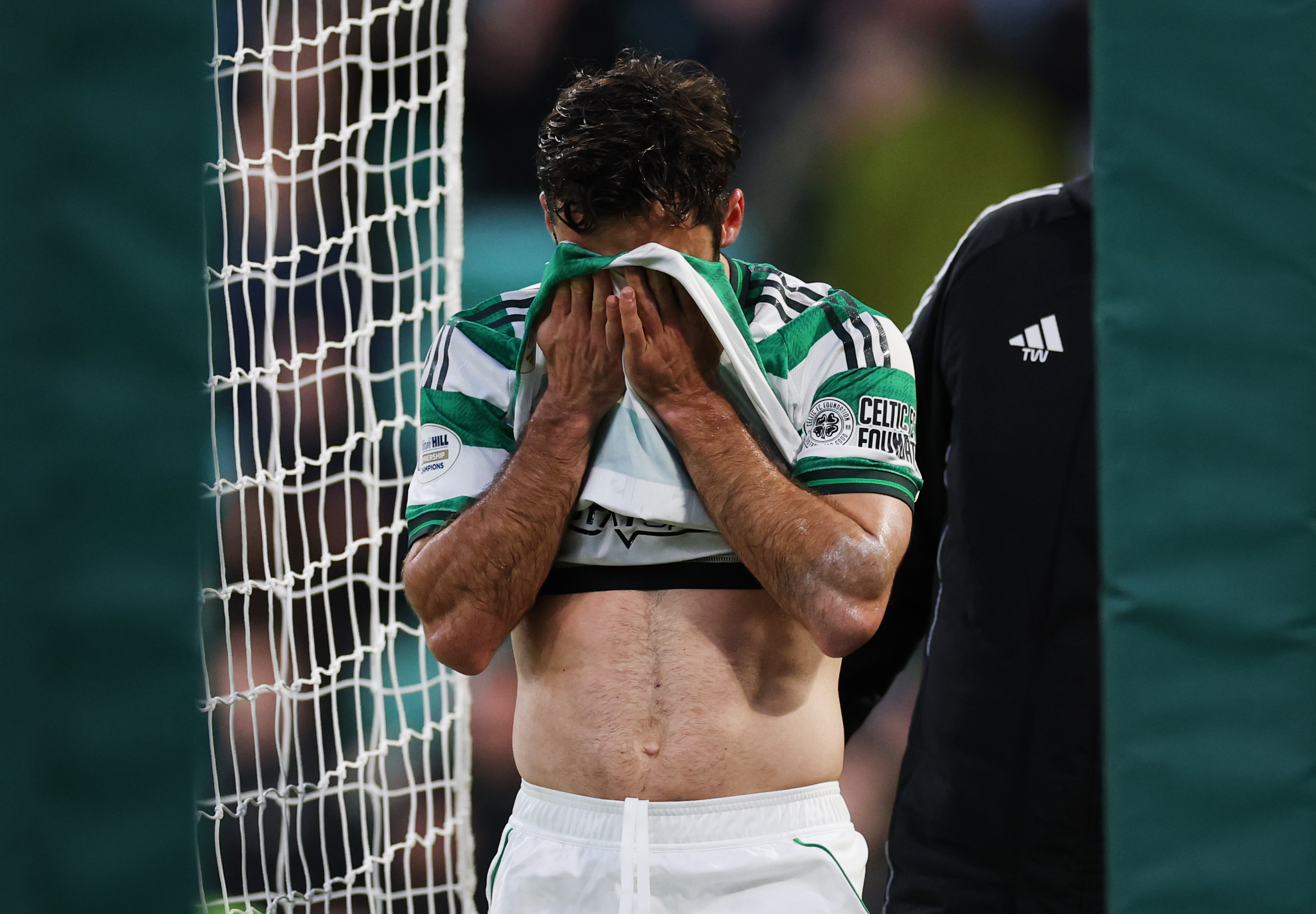 Marcelo Saracchi of Celtic leaves the field injured