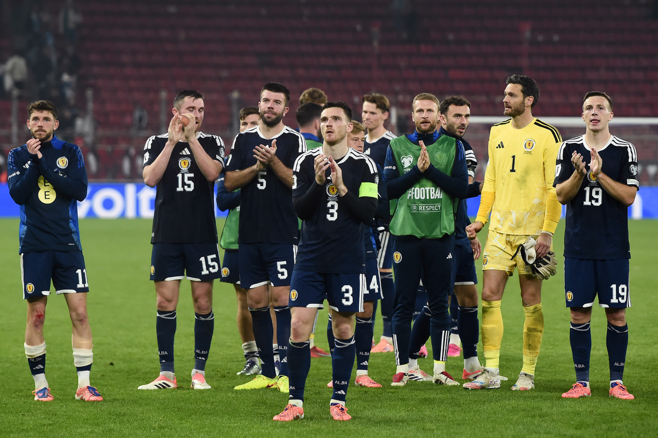 Andy Robertson of Scotland and teammates applaud the fans