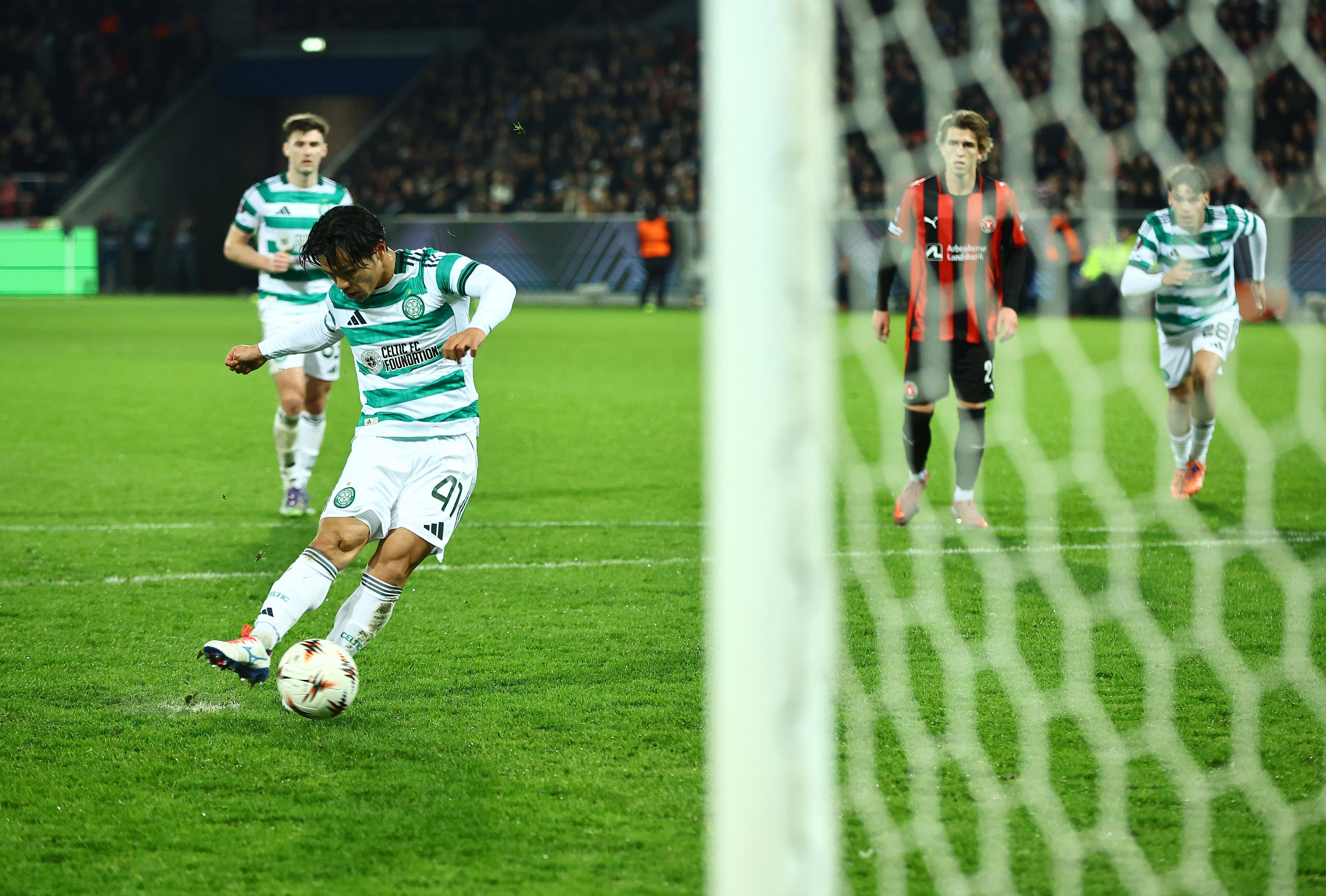 Reo Hatate of Celtic scores