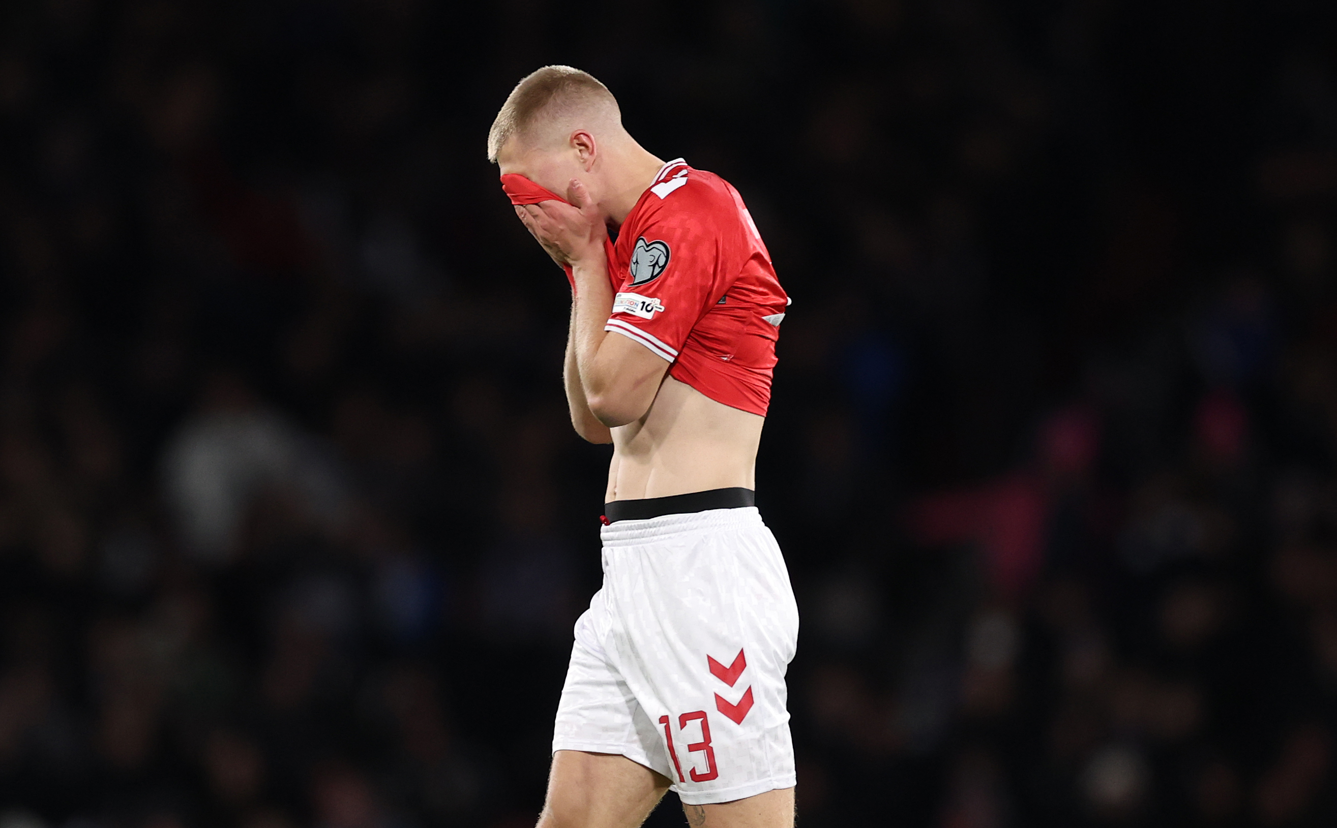 Rasmus Kristensen of Denmark reacts after being sent off