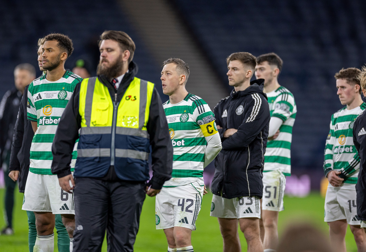 Auston Trusty and Callum McGregor look on.
