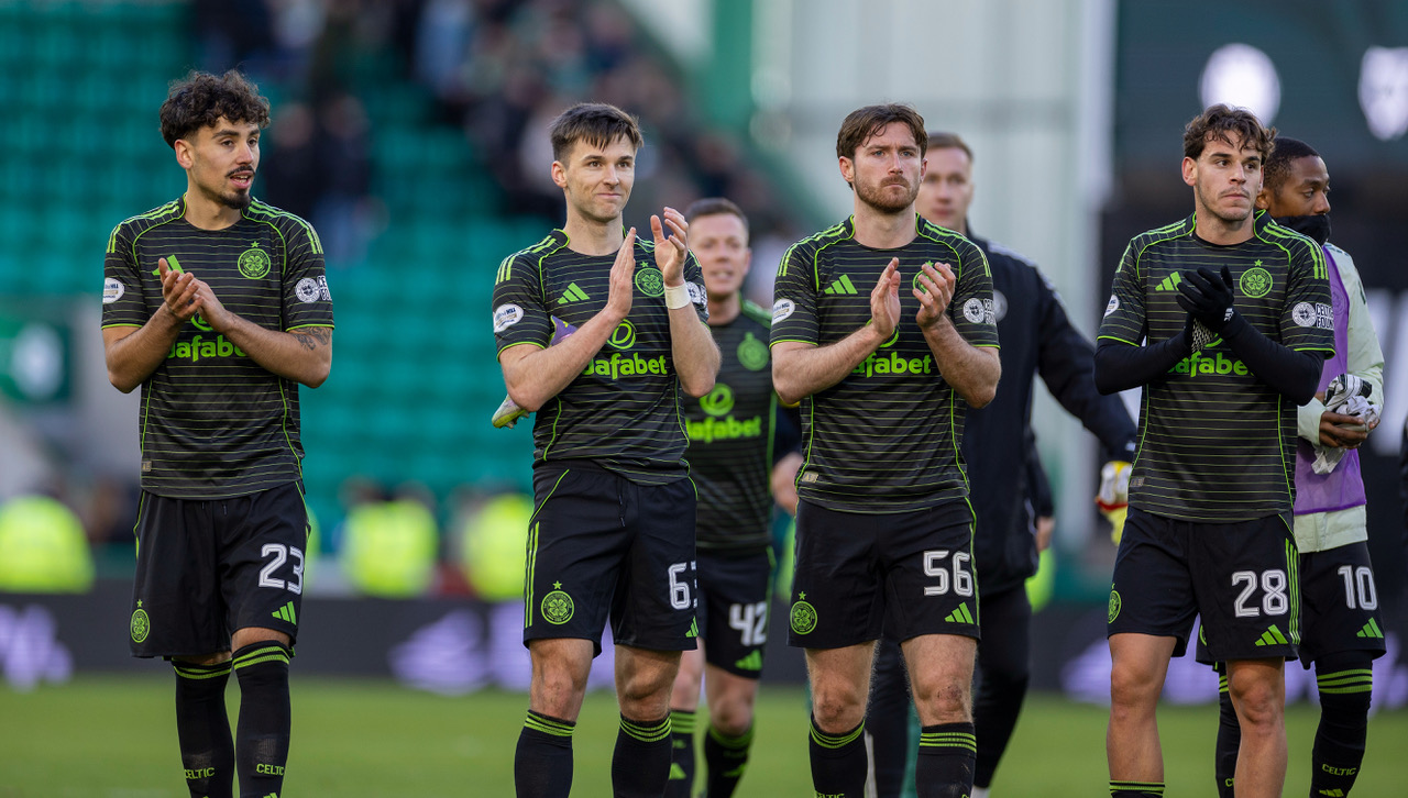 Celtic players applaud the away support at Easter Road.