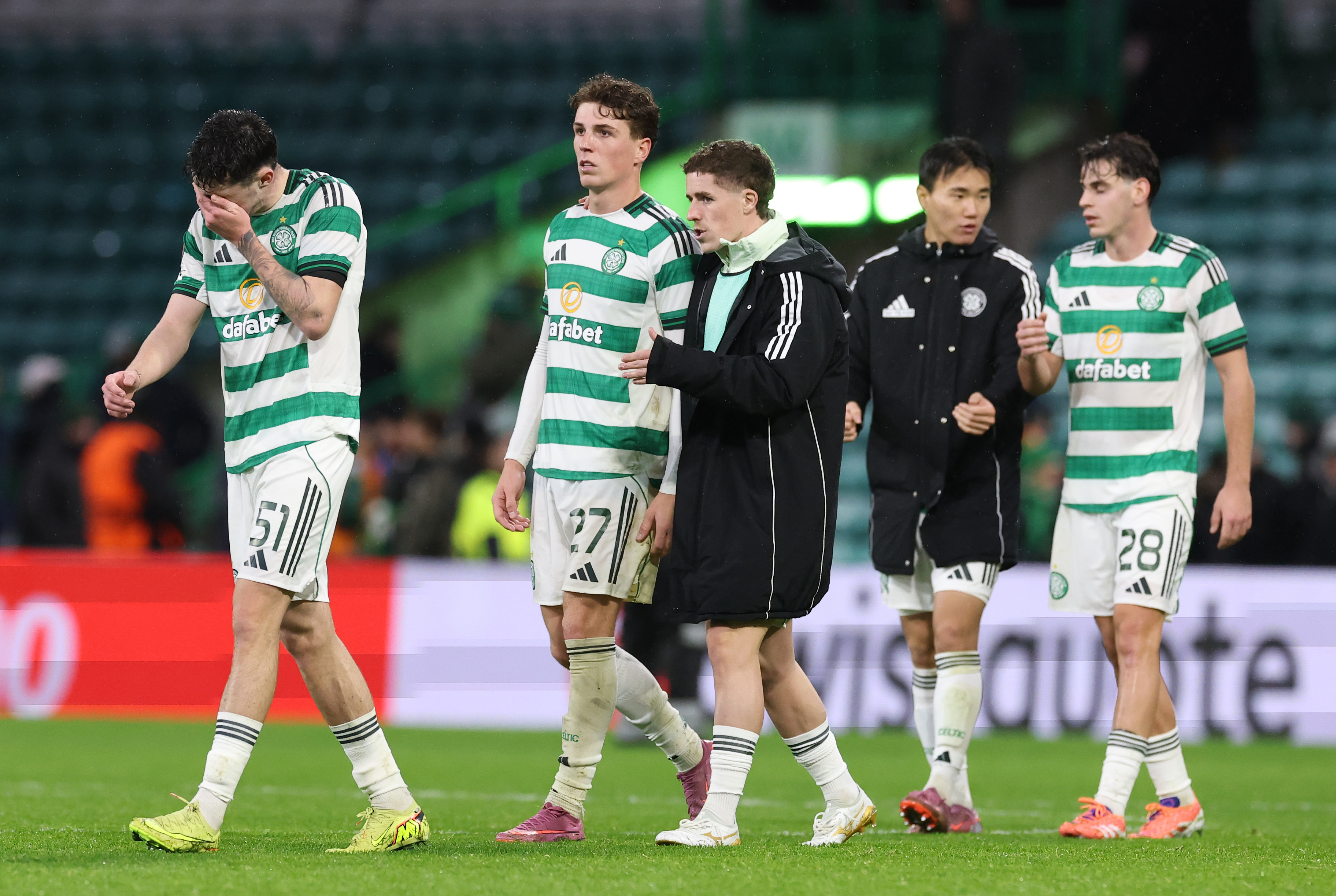 Dejected Celtic players at full-time.