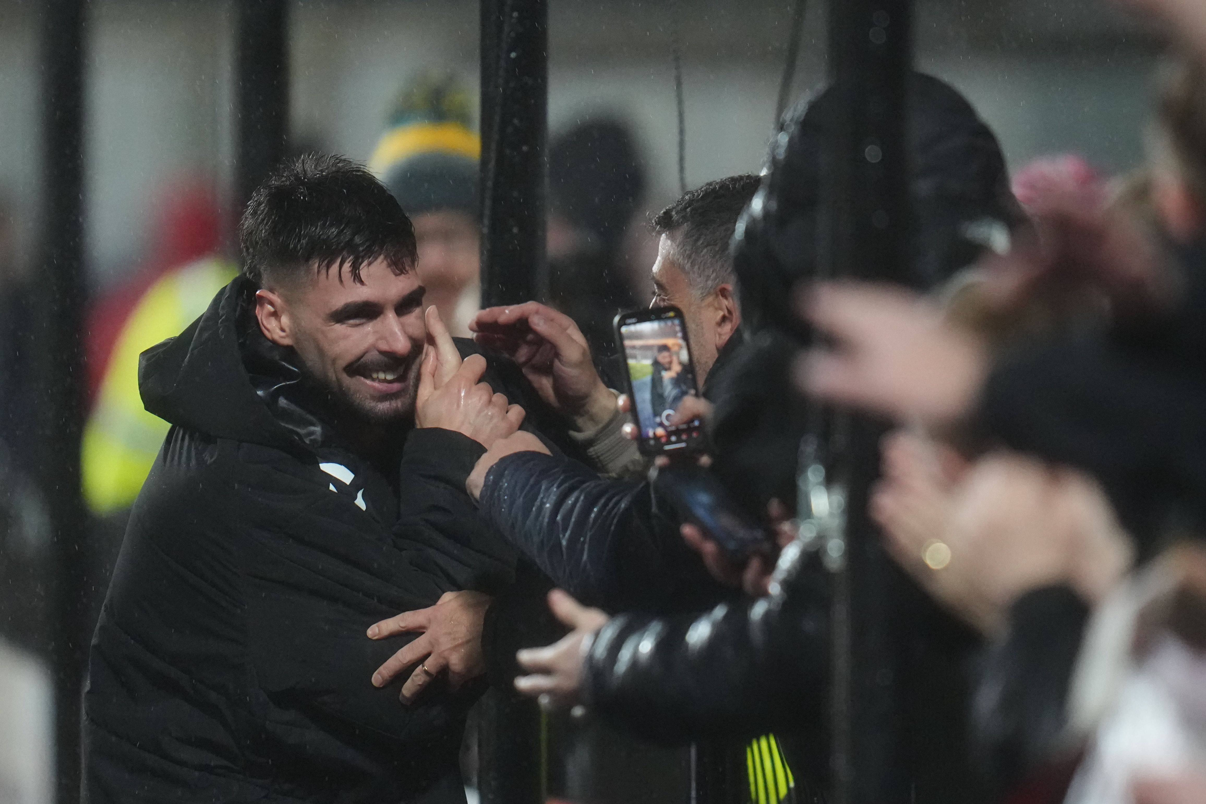 Claudio Braga of Hearts celebrates with fans