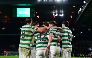 Celtic players celebrate the third goal by James Forrest.