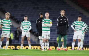 Callum McGregor and Celtic teammates look on