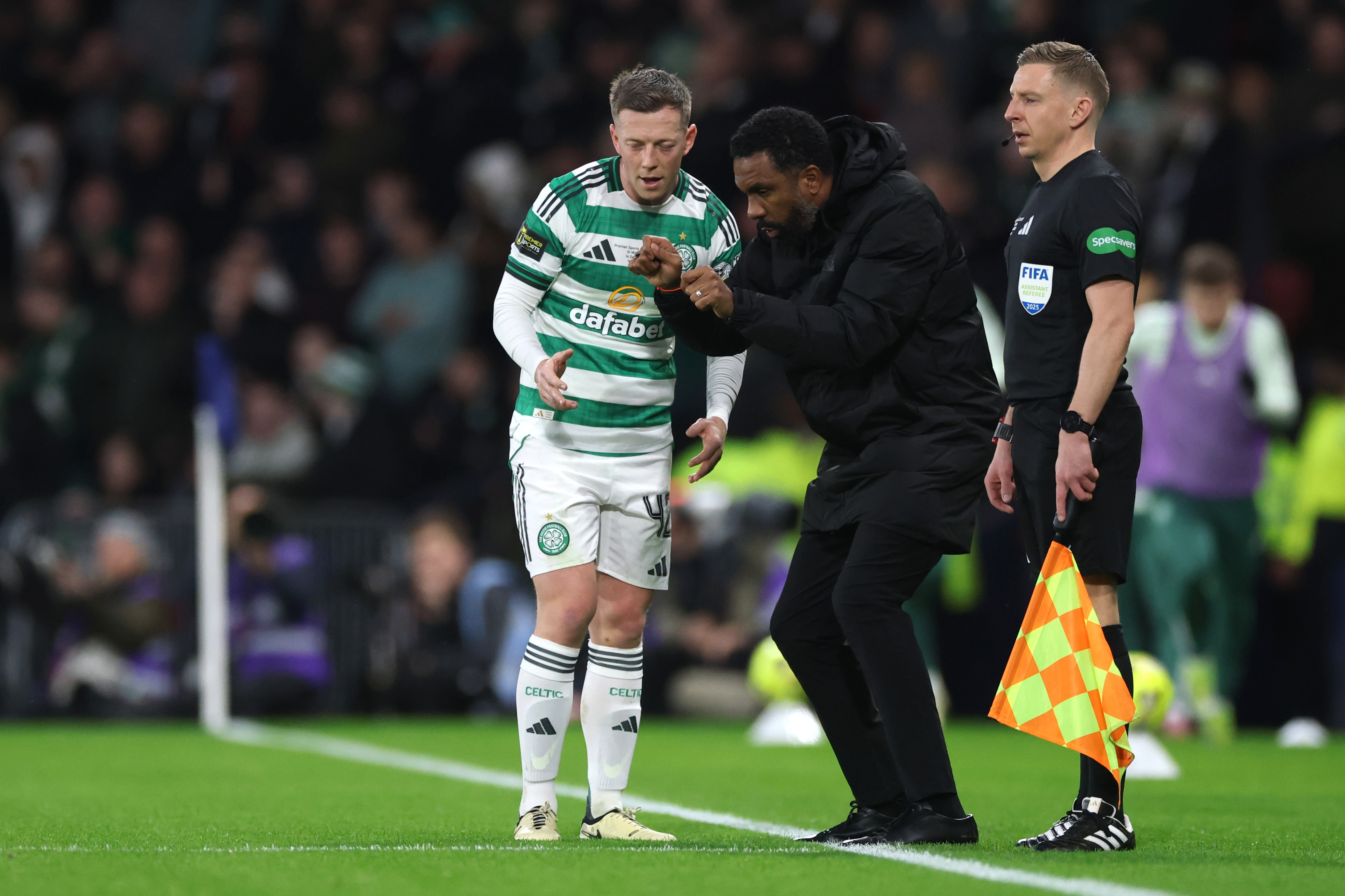 Callum McGregor  receives instructions from Wilfried Nancy