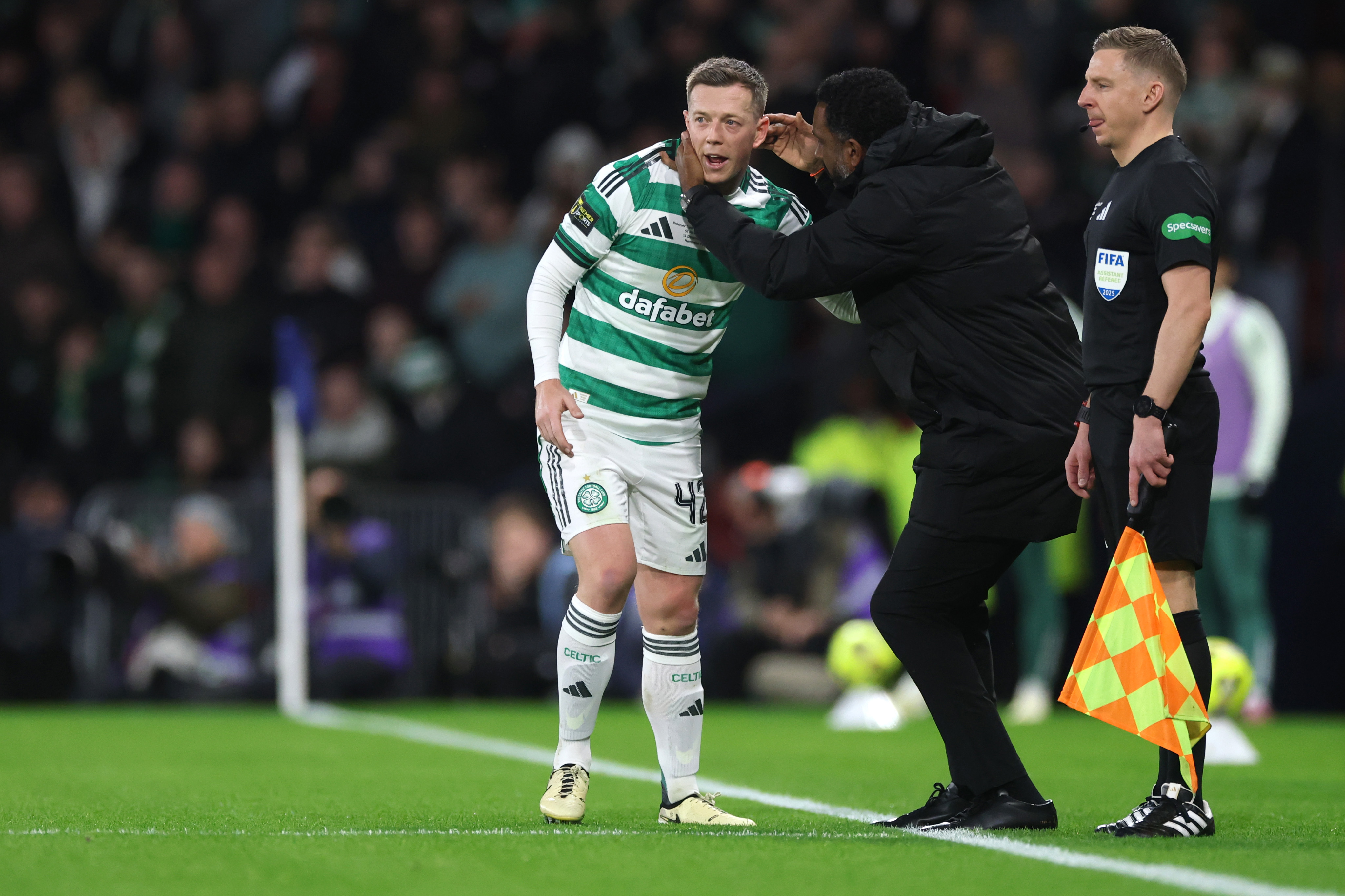 Callum McGregor of Celtic receives instructions from Wilfried Nancy