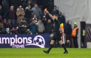 Referee Steven McLean shows Auston Trusty a red card after a VAR review. Hearts v Celtic, 25 January 2025. Photo Vagelis Georgariou.