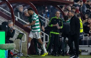 Auston Trusty walks off after being shown a red card. Martin O'Neill looks on.