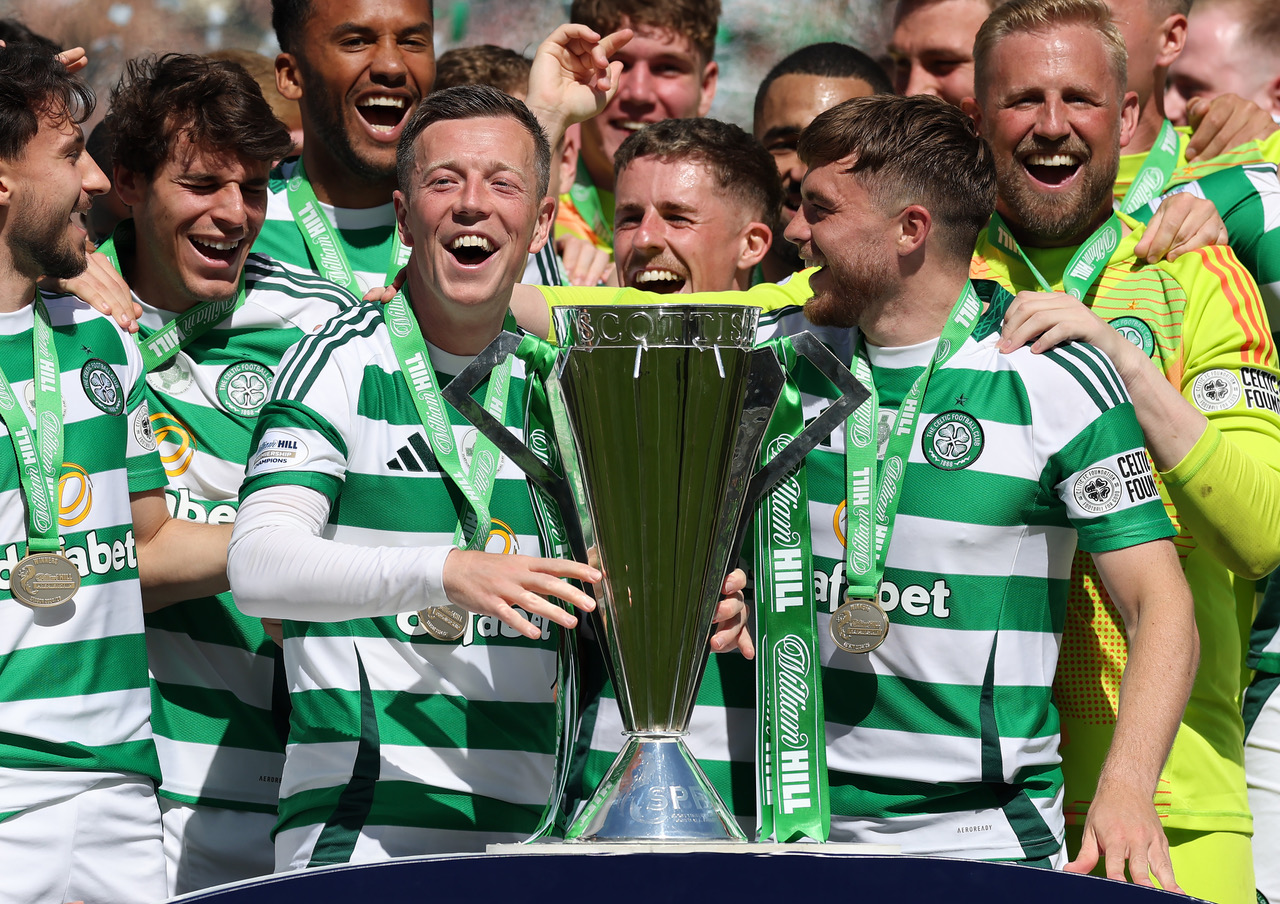 Callum McGregor and James Forrest of Celtic lift the League trophy